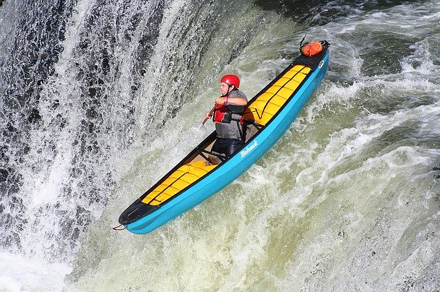 kayaker on a waterfall